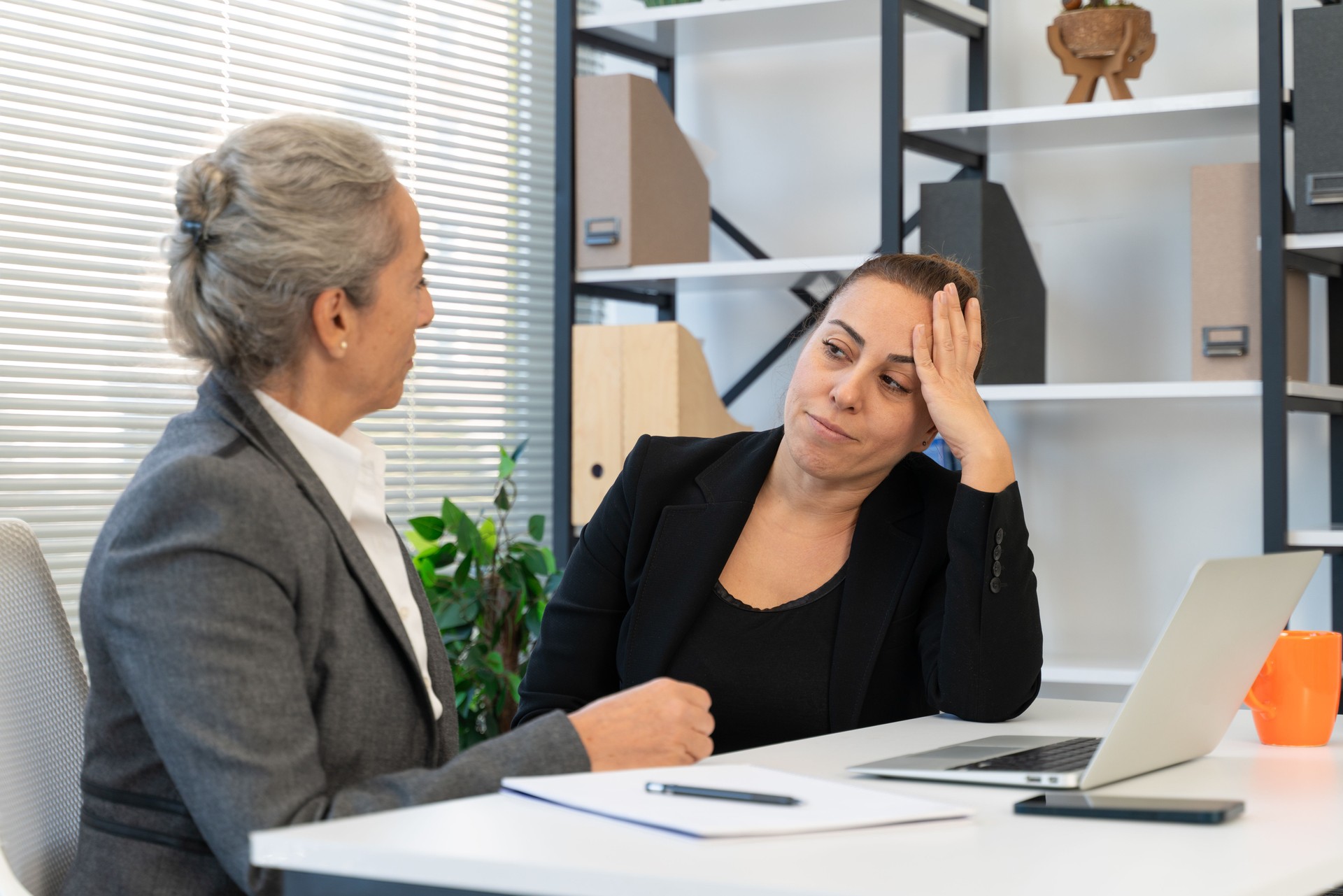 Businesswoman who is unhappy with her job problems gets support from her manager
